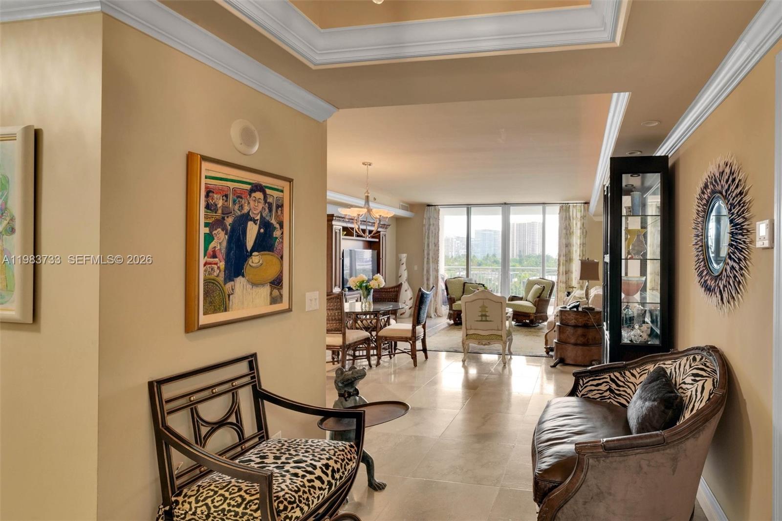 A view from a hallway into a living and dining area with tile floors — 9751 E Bay Harbor Dr # 6C, Bay Harbor Islands FL 33154, BAY HARBOR ISLANDS, FL