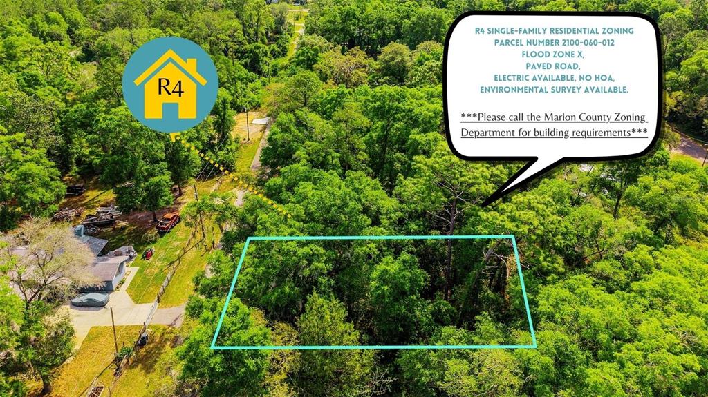 An aerial view shows a wooded, rectangular plot of land outlined in blue — Lot 12 NW 20TH STREET, OCALA, FL