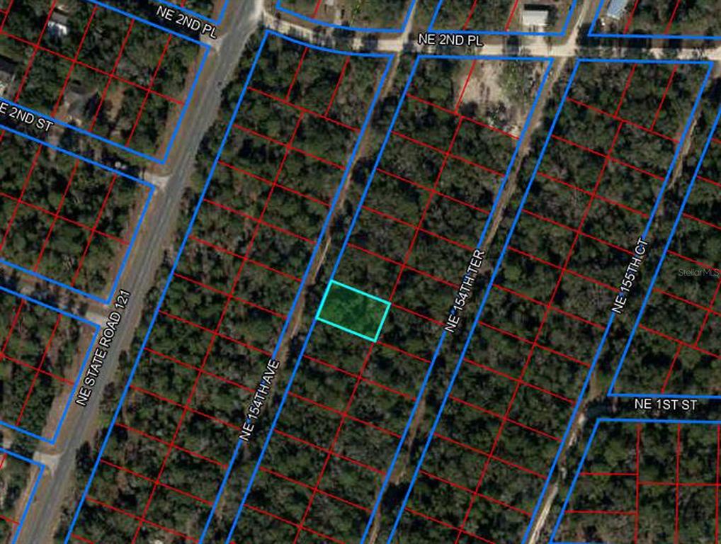 This is an aerial map showing a highlighted rectangular plot of land among wooded lots — tbd NE 154TH AVENUE, WILLISTON, FL