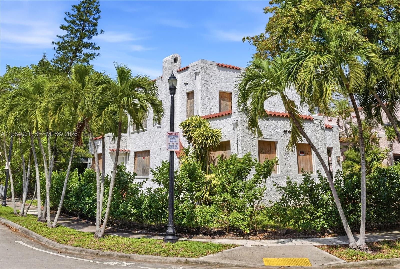 A two-story stucco building with boarded-up windows and a red tile roof — 4400 NE 1st Ave, Miami FL 33137, MIAMI, FL