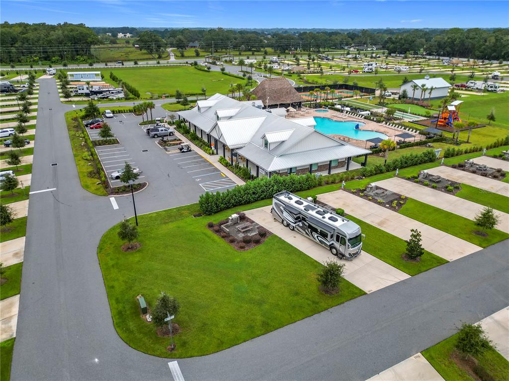 An aerial view shows a clubhouse with a pool, parking lot, and RV sites — 2979 NW 41ST CIRCLE, OCALA, FL