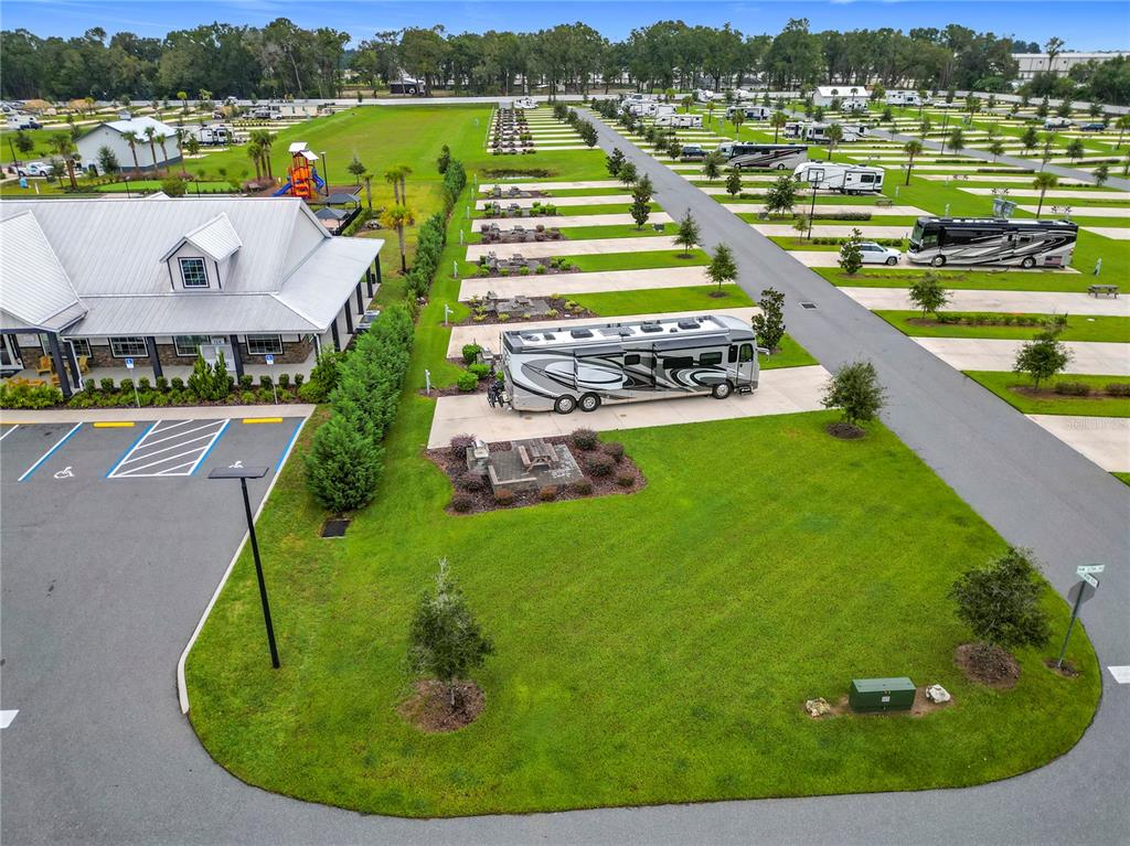 An aerial view shows an RV resort with paved parking pads, grassy areas, and buildings — 2979 NW 41ST CIRCLE, OCALA, FL
