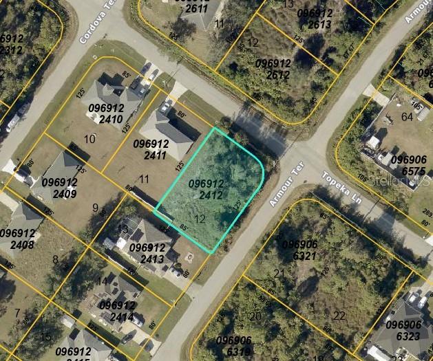 This is an aerial map showing a vacant residential lot highlighted in blue — LOT 12 TOPEKA LANE, NORTH PORT, FL