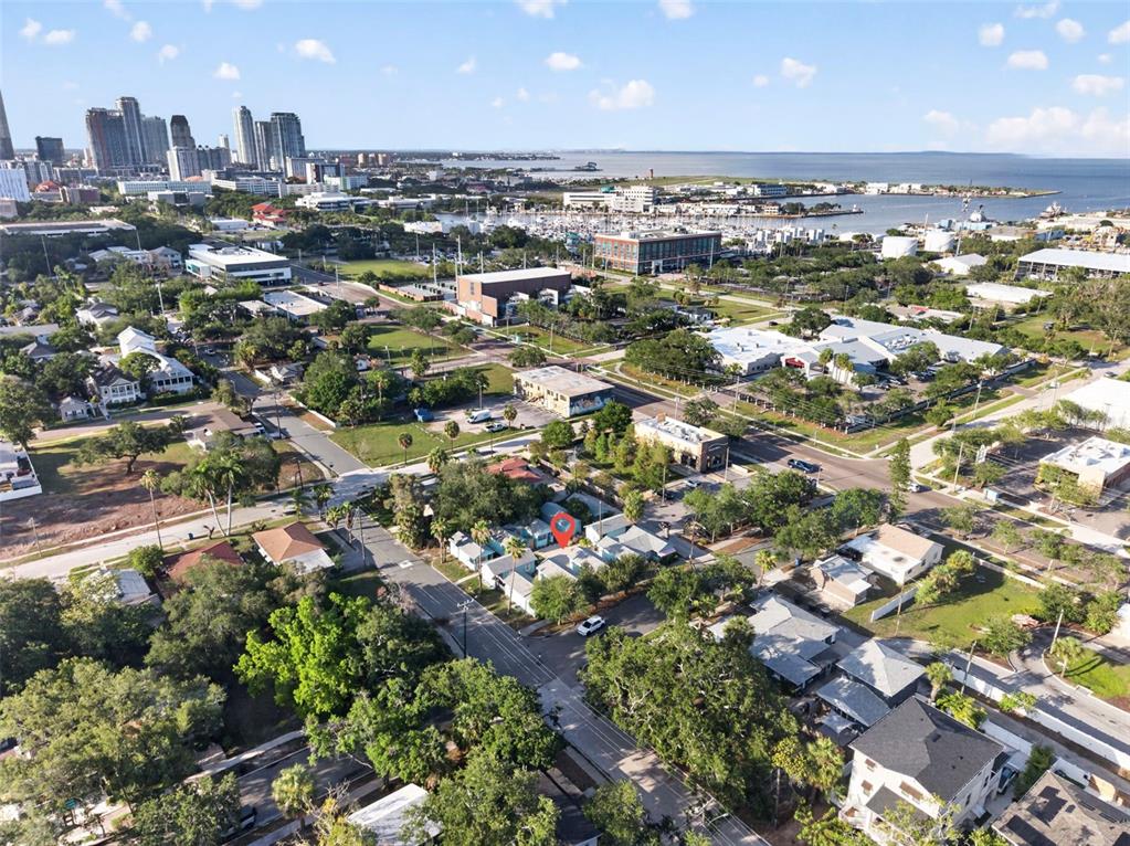 An aerial view shows a residential neighborhood with a red pin marking a specific property — 421 15TH AVENUE S, ST PETERSBURG, FL