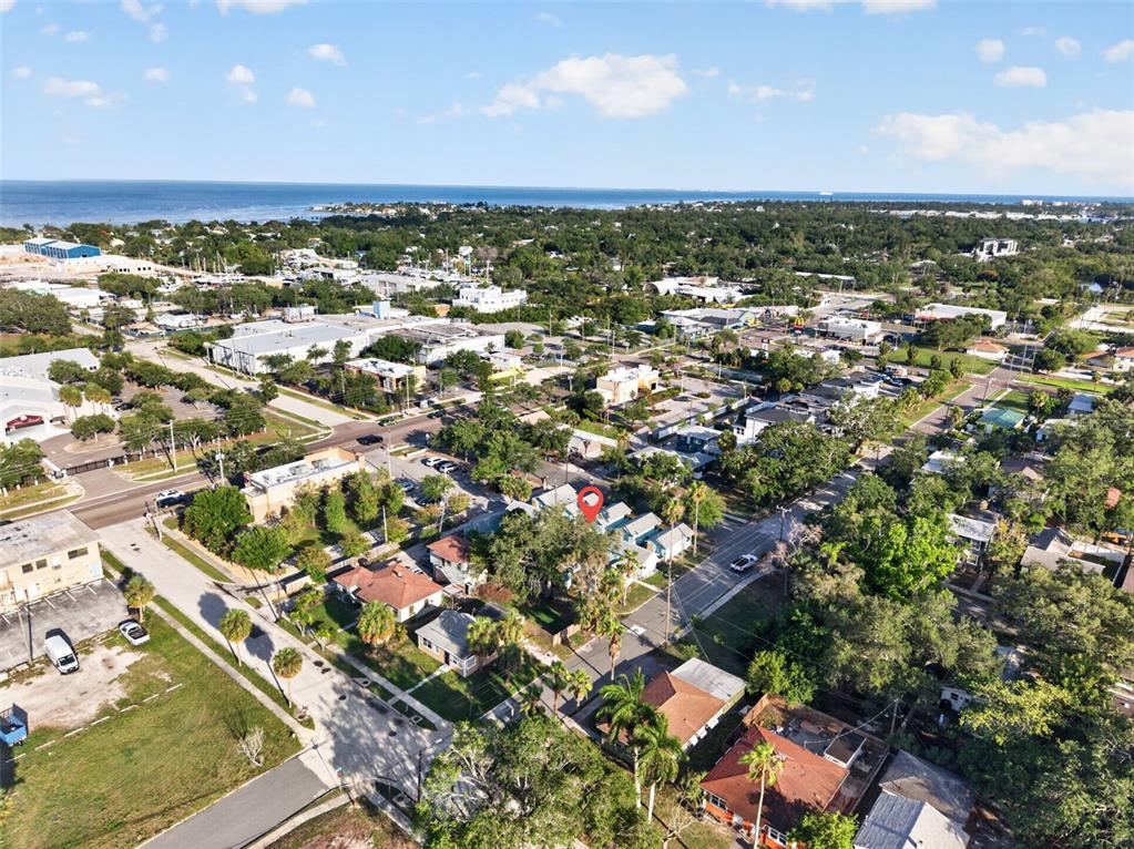 An aerial view shows a residential neighborhood near the coast with a red location marker — 421 15TH AVENUE S, ST PETERSBURG, FL