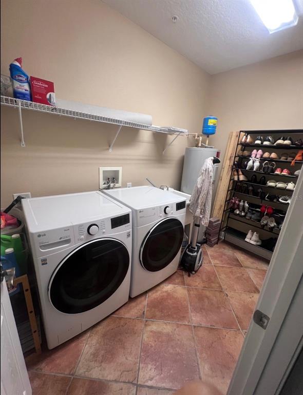A laundry room features white LG appliances, a wire shelf, and a metal shoe rack — 6845 PIAZZA STREET, ORLANDO, FL