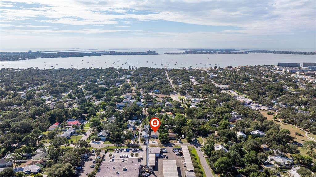 An aerial view shows a residential neighborhood near a large body of water — 5322 25TH AVENUE S, GULFPORT, FL