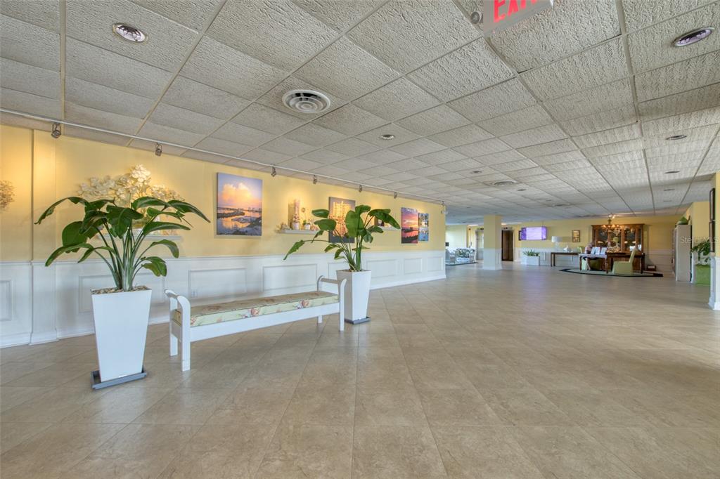 An aerial view of a multi-story apartment building situated on a waterfront lot with docks — 31 ISLAND WAY UNIT 508, CLEARWATER BEACH, FL