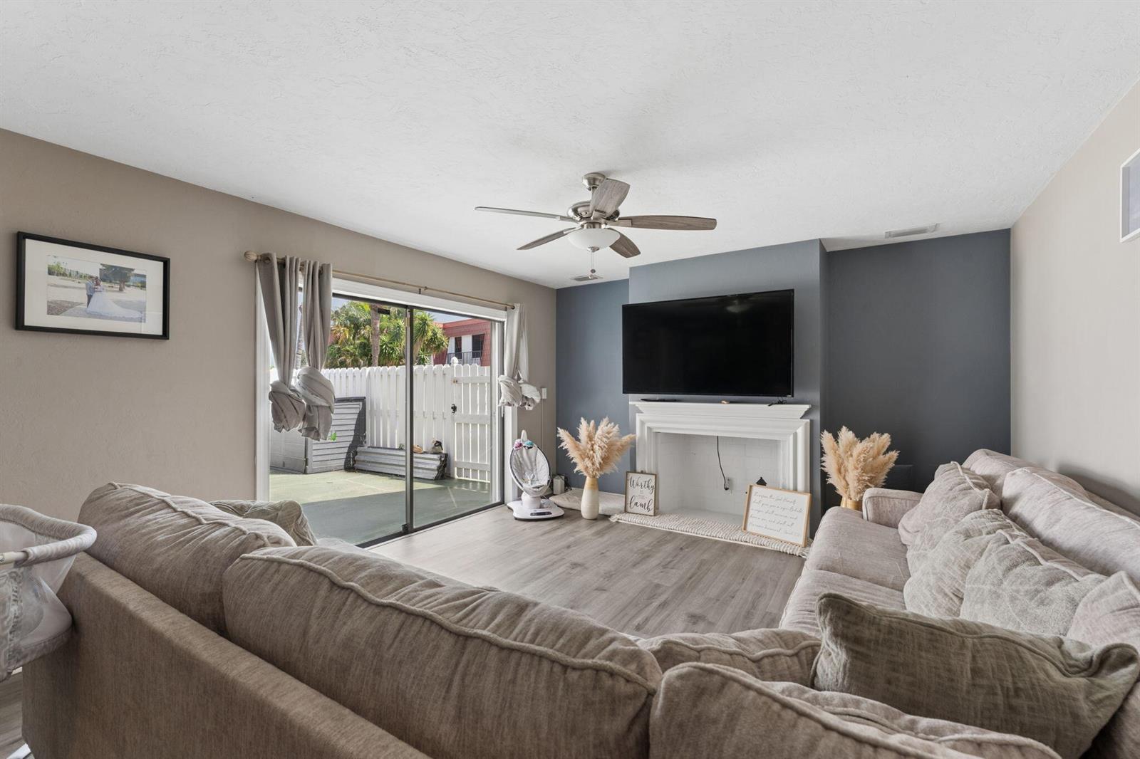 A bathroom features a gray vanity, a white countertop, a toilet, and a glass-enclosed shower — 1425 Oxford Lane, Boynton Beach FL 33426, BOYNTON BEACH, FL