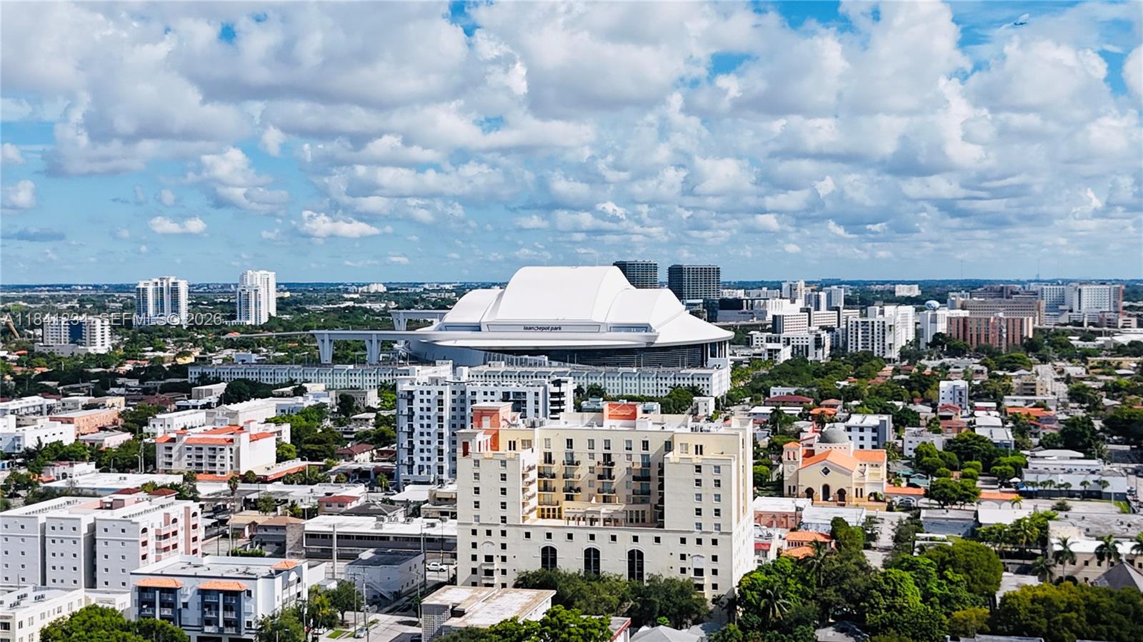 An aerial view shows a large stadium with a white roof surrounded by city buildings — 1238 SW 4th St, Miami FL 33135, MIAMI, FL