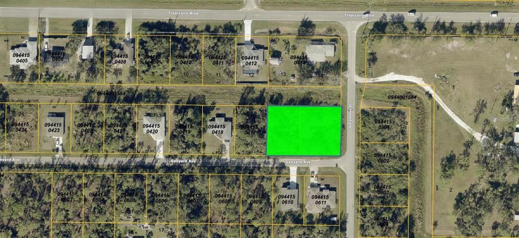 This is an aerial map showing a highlighted vacant lot located at a street intersection — GANYARD AVENUE, NORTH PORT, FL