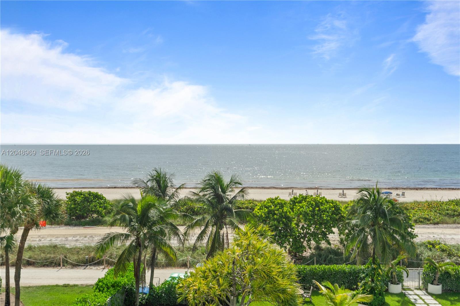 A view of a sandy beach and the ocean from an elevated outdoor perspective — 9511 Collins Ave # 403, Surfside FL 33154, SURFSIDE, FL
