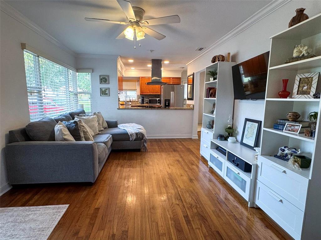 A white single-story house features a carport, a palm tree, and a concrete walkway — 552 PALENCIA PLACE, LAKELAND, FL