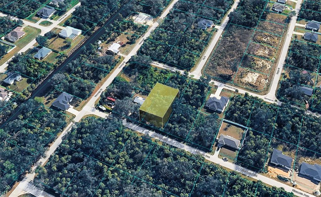 An aerial view shows a vacant, wooded residential lot highlighted in yellow — 16491 STRAUSS AVENUE, PORT CHARLOTTE, FL