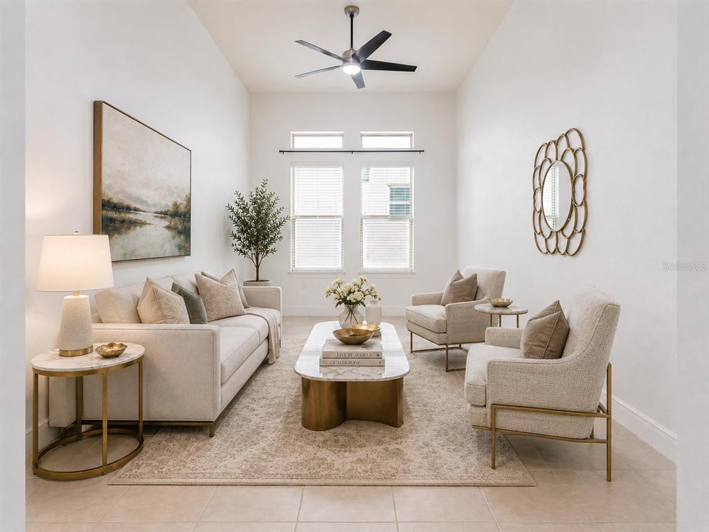 A neutral-toned living room features a sofa, two armchairs, a coffee table, and a ceiling fan — 10370 DOTH STREET, ORLANDO, FL