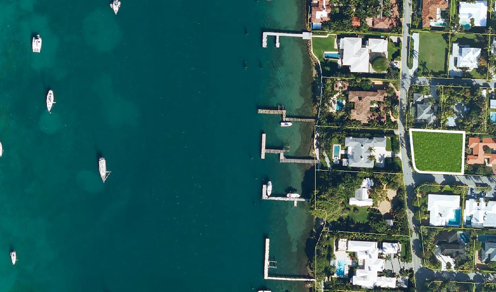 An aerial view shows a vacant rectangular lot situated in a residential waterfront neighborhood — 1421 N Lake Way, Palm Beach FL 33480, PALM BEACH, FL