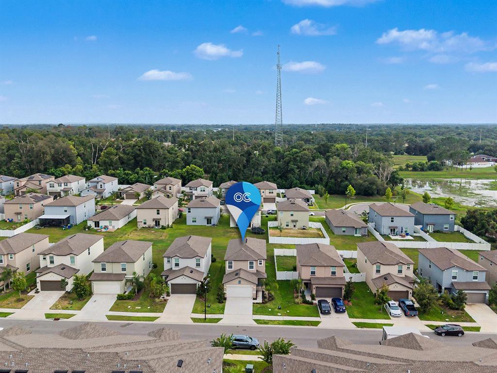 An aerial view shows a suburban neighborhood with detached houses and a central location marker — 36420 GARDEN WALL WAY, ZEPHYRHILLS, FL