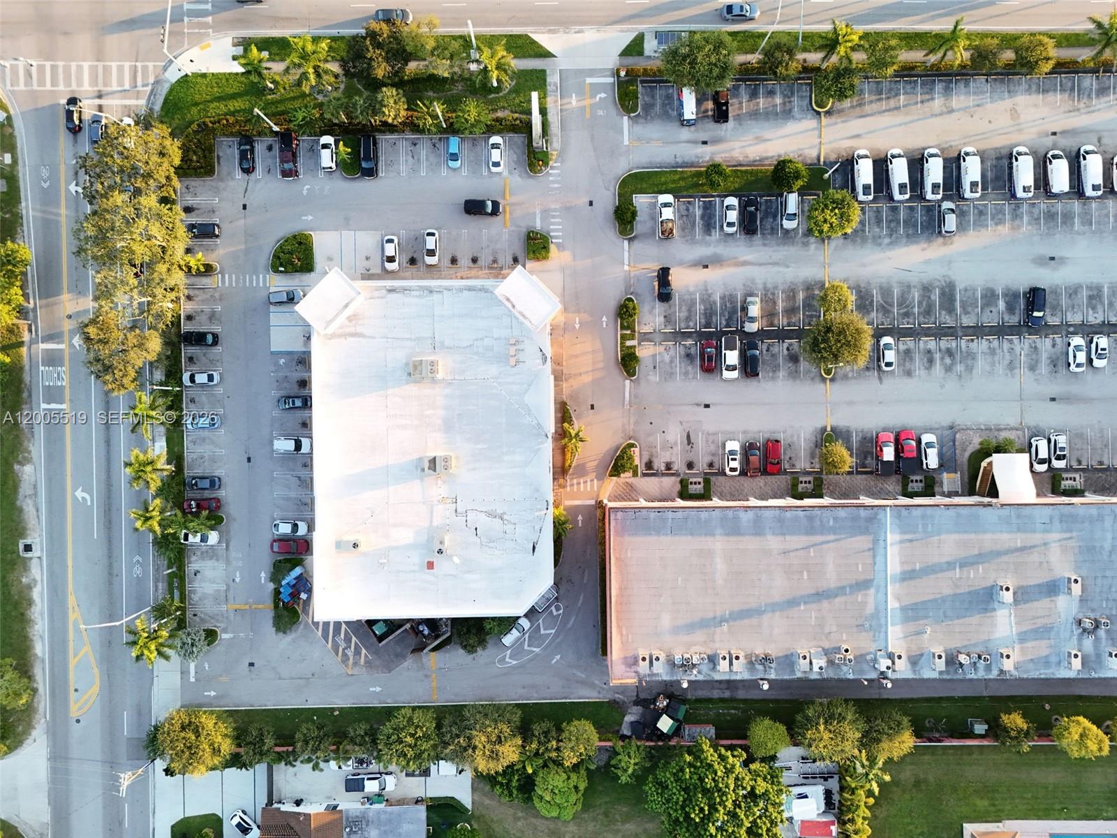 An aerial view shows two commercial buildings surrounded by parking lots and landscaped areas — 12711 SW 42nd St, Miami FL 33175, MIAMI, FL