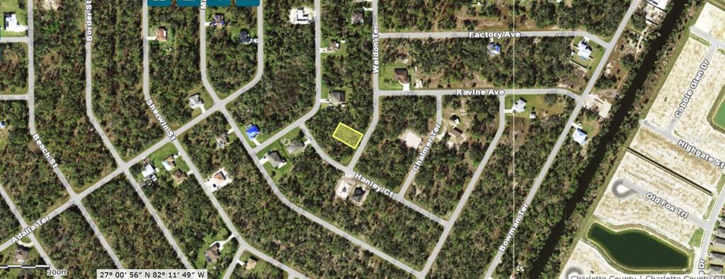 This is an aerial map showing a vacant residential lot highlighted in yellow — 1145 WELDON TERRACE, PORT CHARLOTTE, FL