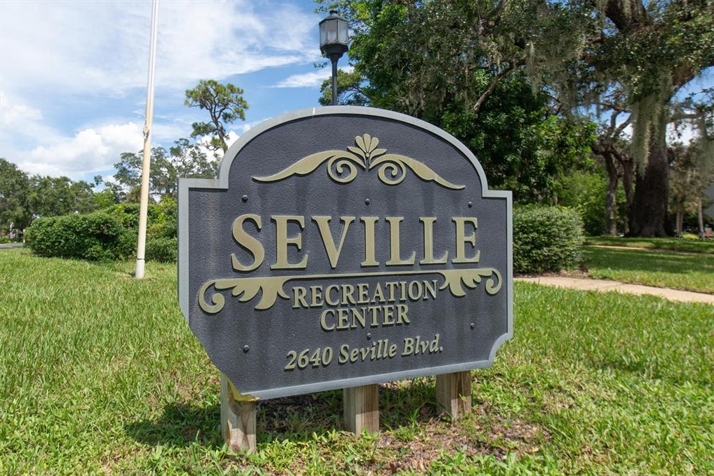 A dark gray sign for the Seville Recreation Center stands on a grassy lawn — 2612 PEARCE DRIVE UNIT 310, CLEARWATER, FL