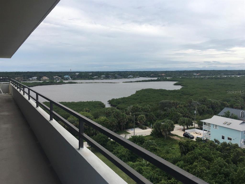 An elevated view of a coastal neighborhood featuring houses, a road, and the ocean — 1601 CENTRAL AVENUE UNIT 704, FLAGLER BEACH, FL