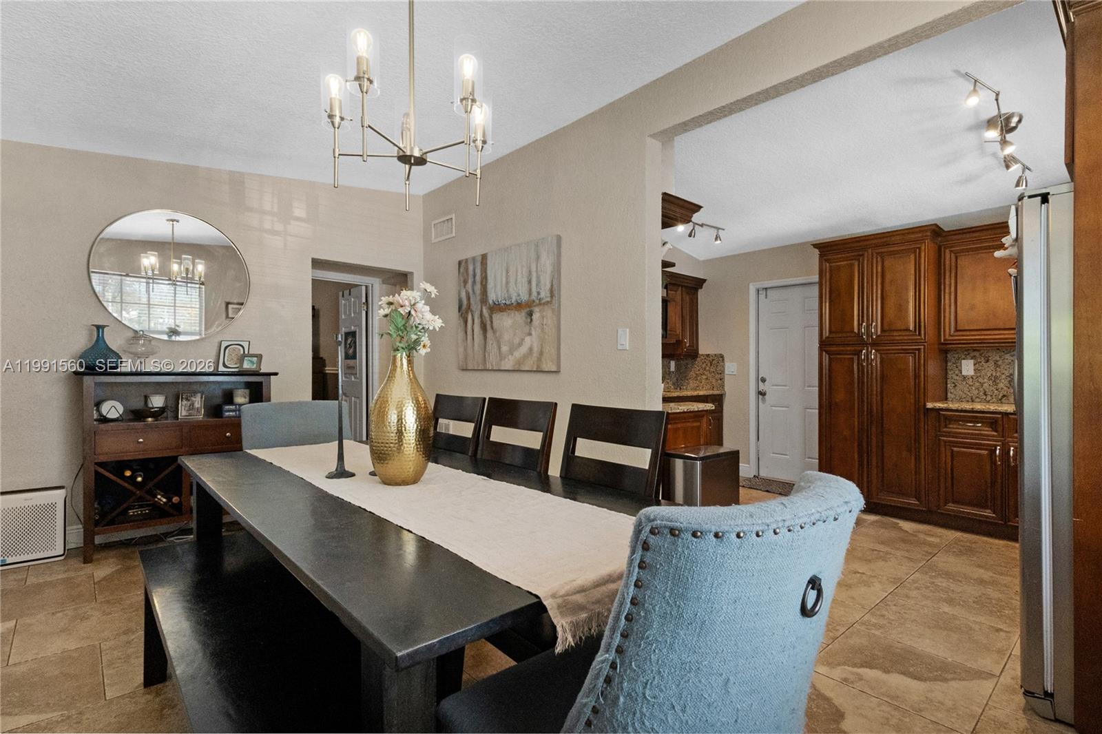 A white house with a black roof, covered porch, and black front door — 3500 SW 13th St, Miami FL 33145, MIAMI, FL