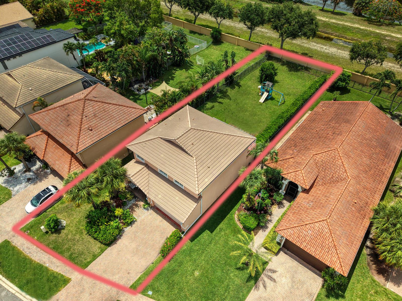 An aerial view shows a two-story house with a tiled roof and a fenced backyard — 149 Bellezza Terrace, Royal Palm Beach FL 33411, ROYAL PALM BEACH, FL