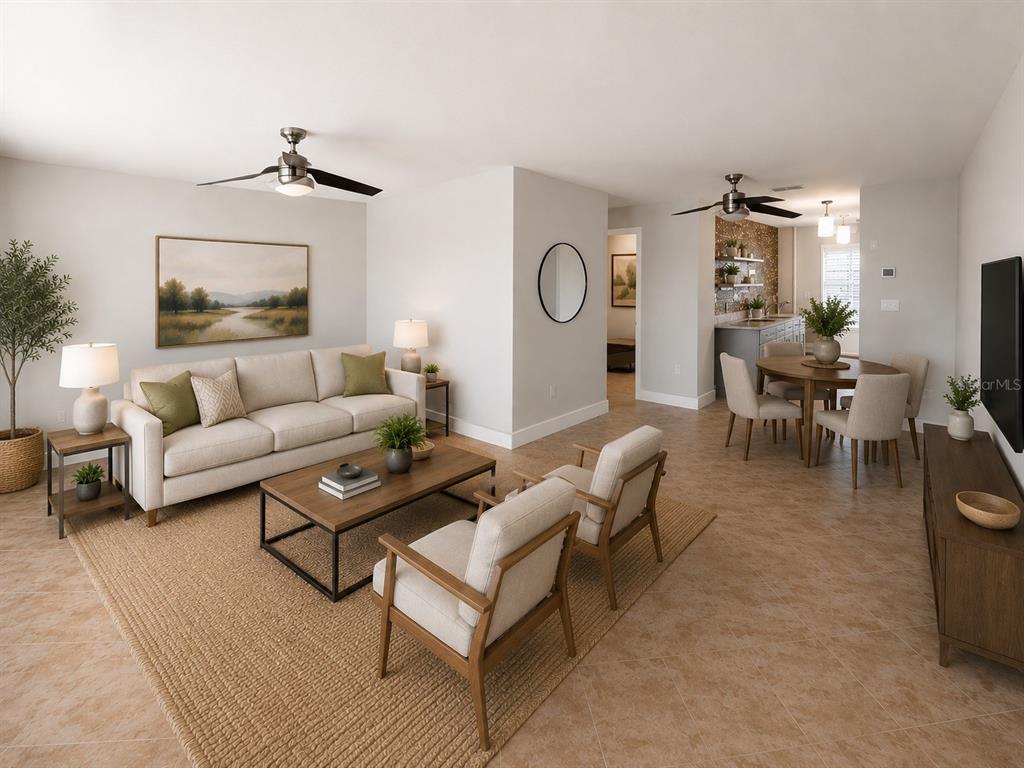 This living and dining area features tile flooring, neutral furniture, and two ceiling fans — 3128 59TH STREET S UNIT 109, GULFPORT, FL