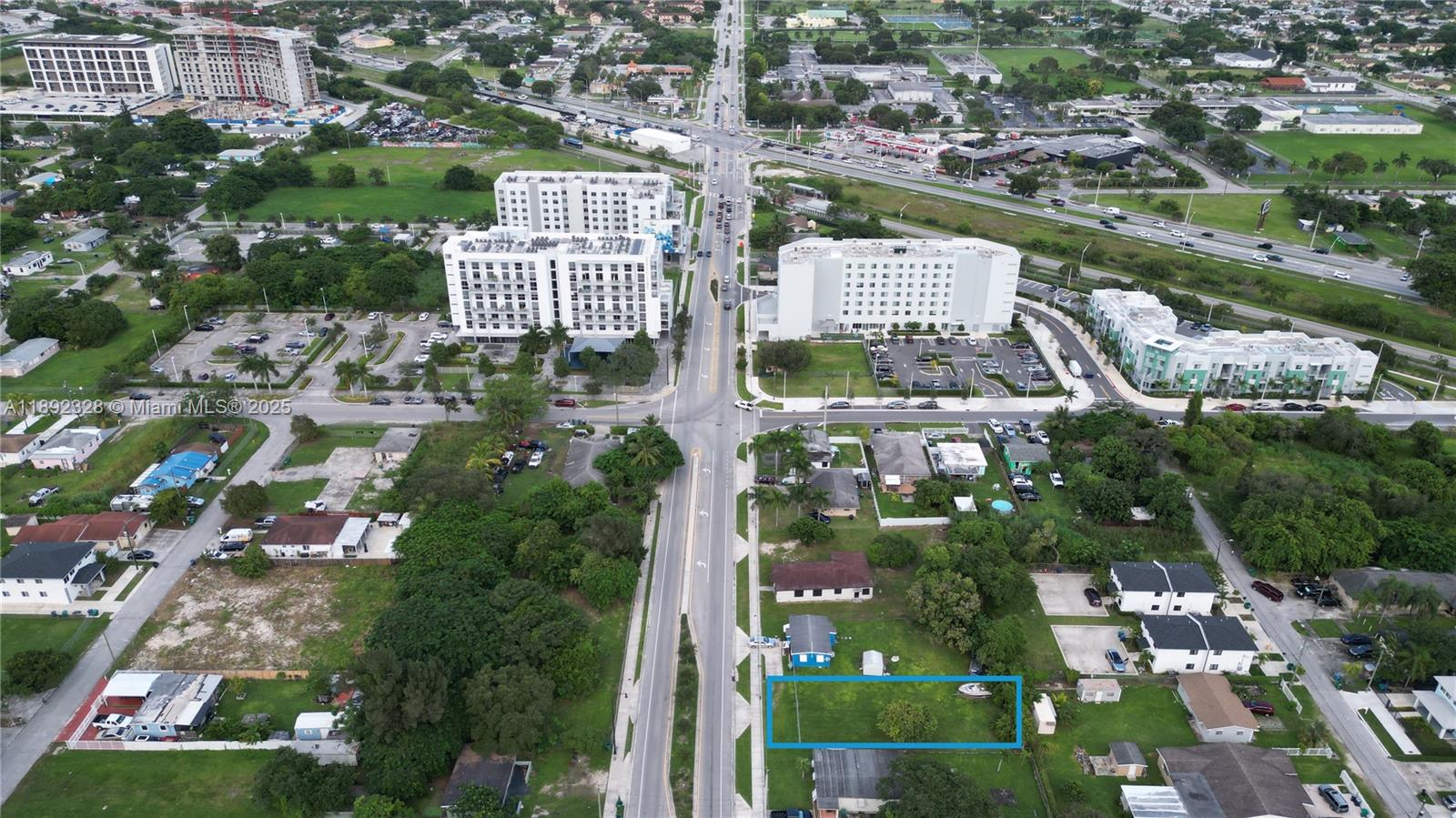 An aerial view shows a rectangular vacant lot highlighted in blue within a residential neighborhood — SW, Miami FL 33170, MIAMI, FL