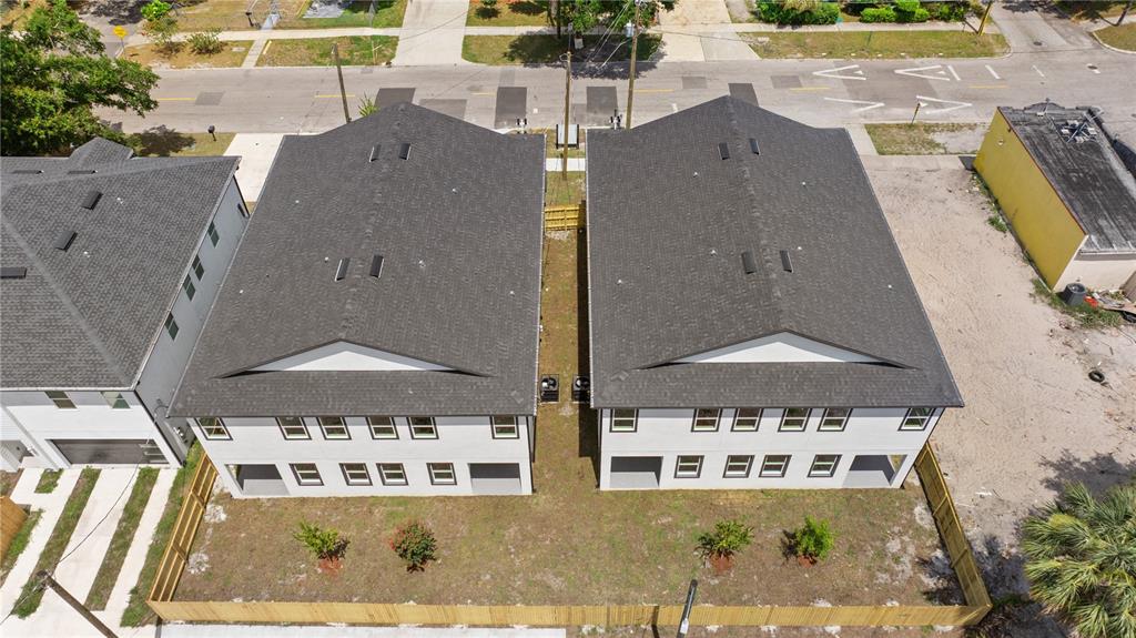 An aerial view shows two modern, two-story houses with dark roofs and white siding — 2806 N 29TH STREET UNIT 1, TAMPA, FL