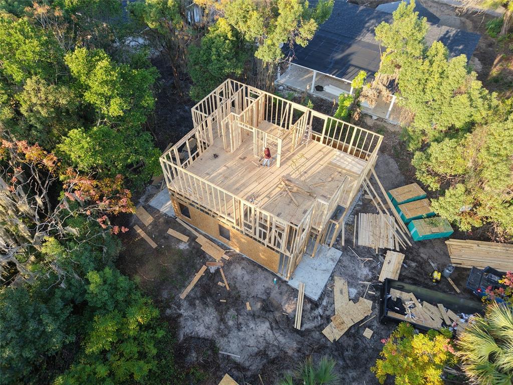 An aerial view shows the wooden framing of a two-story house under construction — 1307 OCEAN STREET, PALATKA, FL