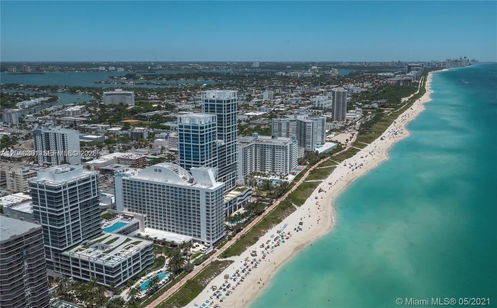 Aerial view of high-rise buildings along a sandy beach and the ocean — 6801 Collins Ave, Miami Beach FL 33141, MIAMI BEACH, FL