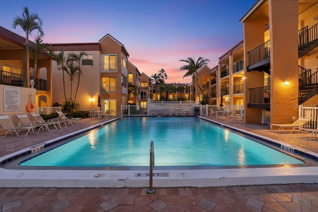 This is a floor plan showing a three-bedroom, two-bathroom home with a patio — 8911 BLIND PASS ROAD UNIT 118, ST PETE BEACH, FL