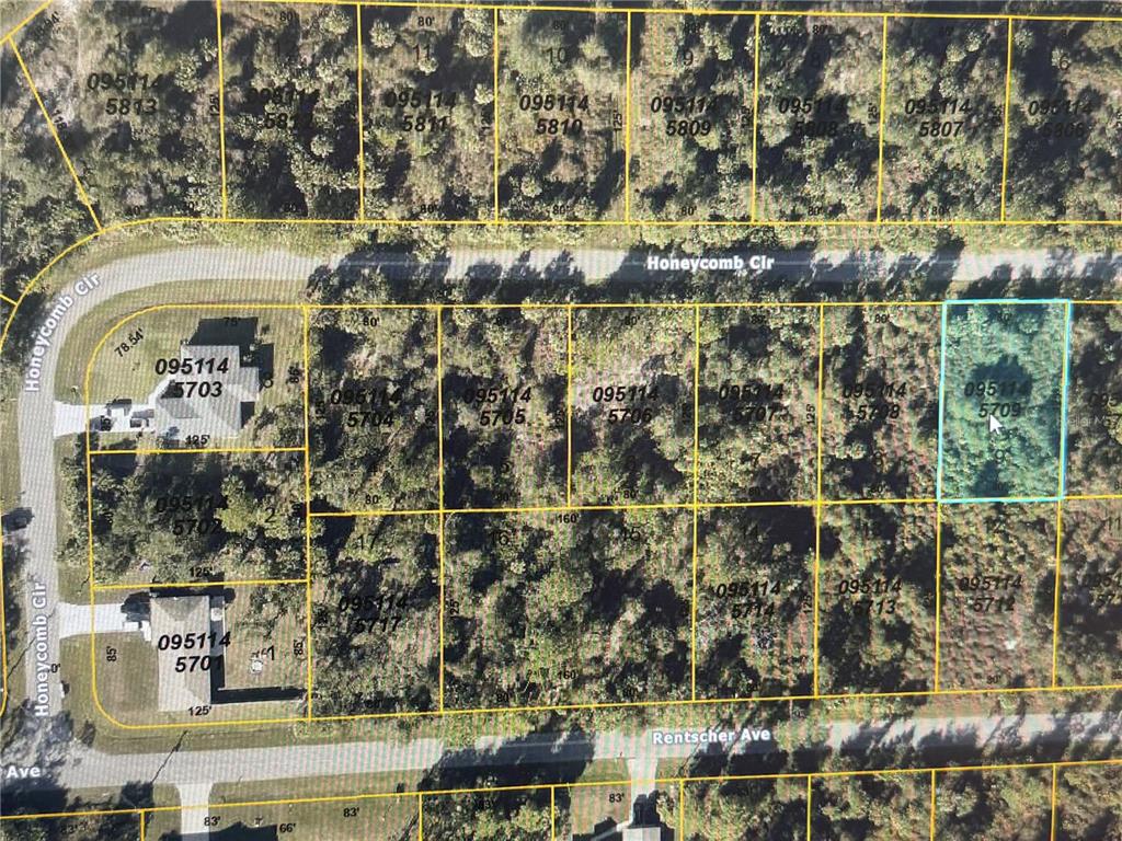 This is an aerial map showing residential lots and streets in a wooded area — Lot 9 HONEYCOMB CIRCLE, NORTH PORT, FL