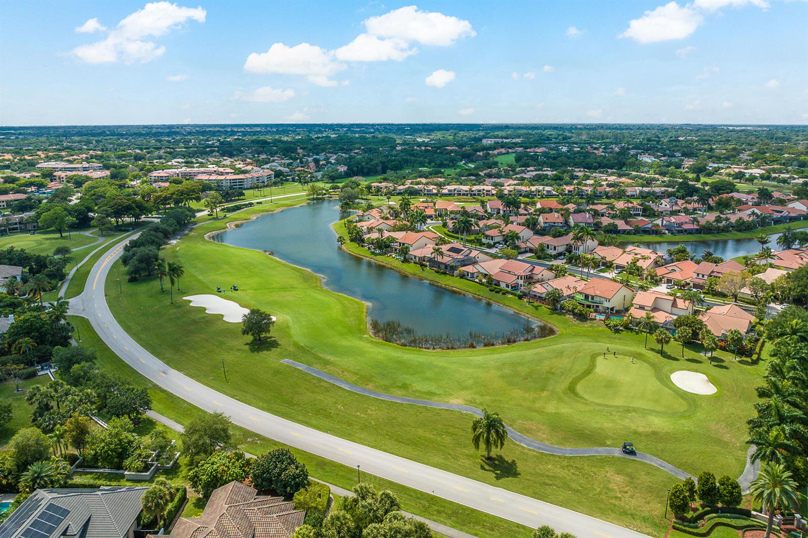 An aerial view shows a golf course fairway, a lake, and surrounding residential homes — 6626 Via Regina, Boca Raton FL 33433, BOCA RATON, FL