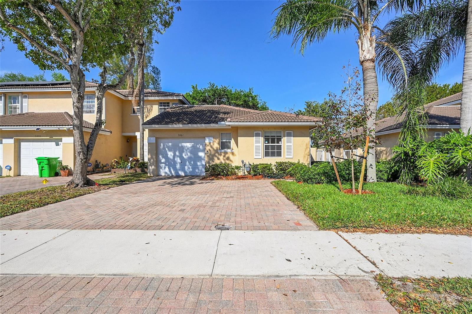 A one-story residential house with a brick driveway, a garage, and a tiled roof — 5361 NW 90th Avenue, Sunrise FL 33351, SUNRISE, FL