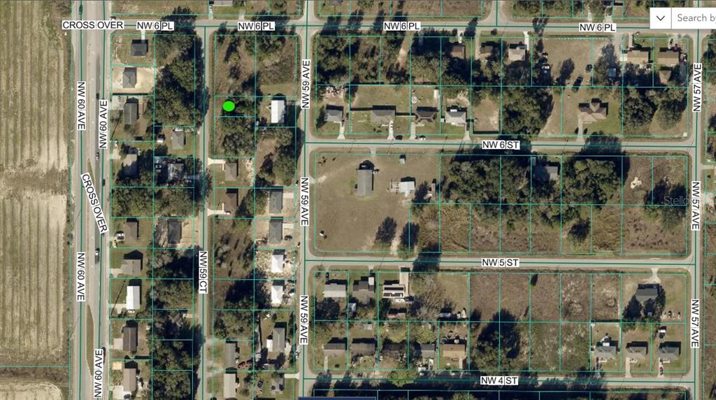 This is an aerial map view of a residential neighborhood with outlined property lots — NW 59 COURT, OCALA, FL