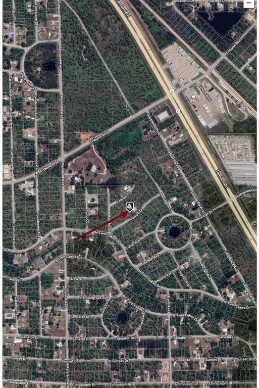 This is an aerial map view showing a residential neighborhood with a red location marker — 28090 RAMIRO DRIVE, PUNTA GORDA, FL