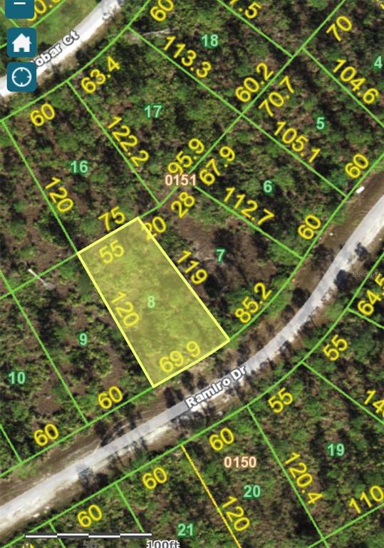 This is a satellite map showing a highlighted rectangular land parcel along a curved road — 28090 RAMIRO DRIVE, PUNTA GORDA, FL