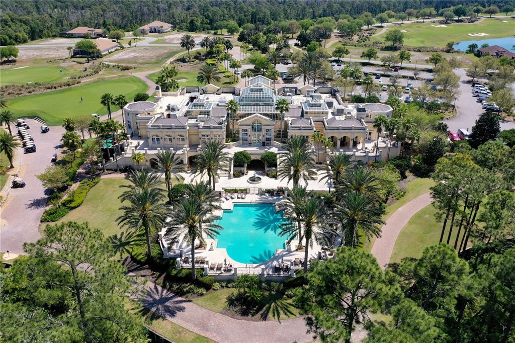 An aerial view of a large mansion with a swimming pool and surrounding golf course — 699 MAHOGANY RUN, PALM COAST, FL