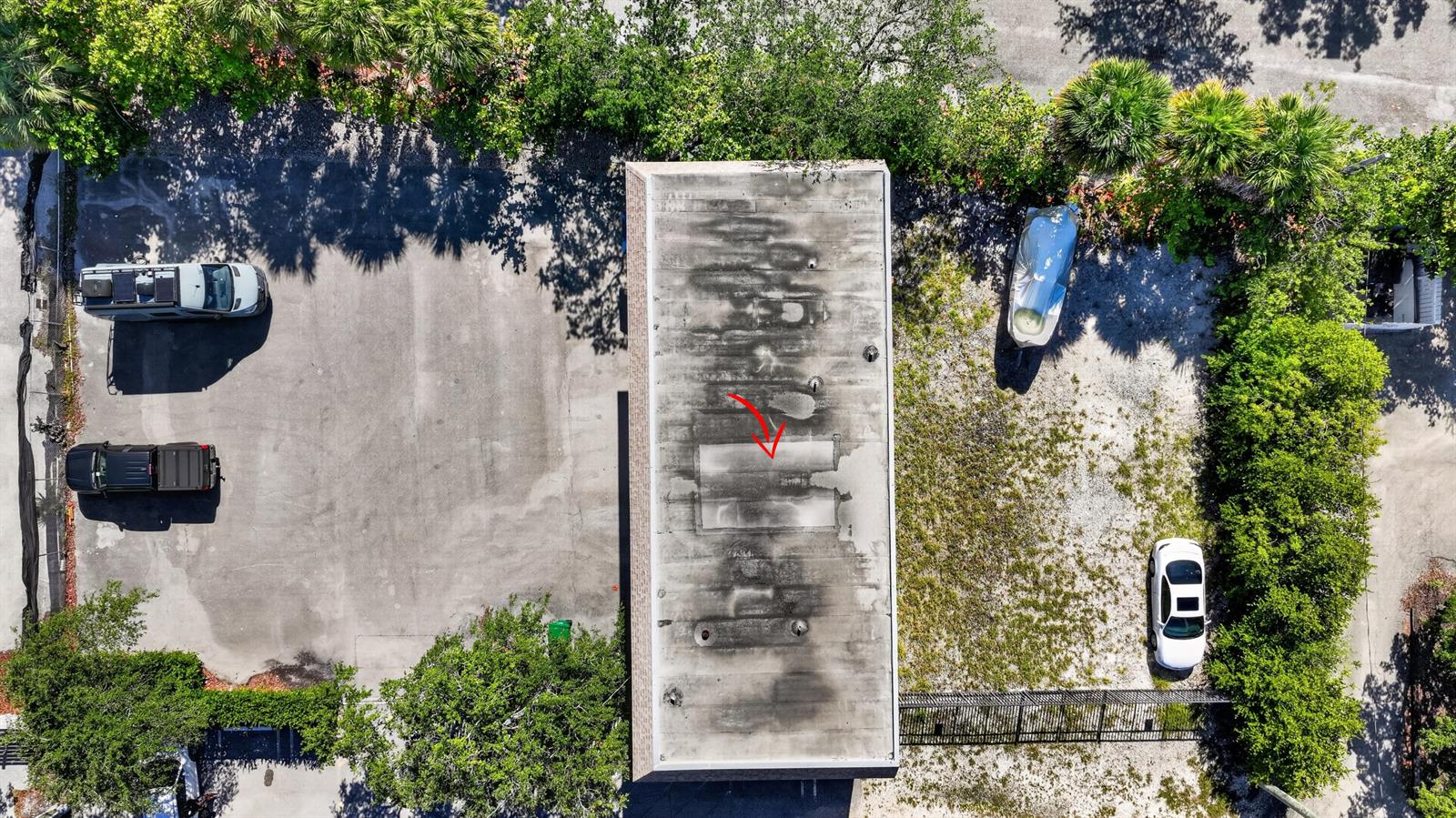 An aerial view shows a flat-roofed building with a rectangular skylight and surrounding parking areas — 234 NE 4th Avenue, Delray Beach FL 33483, DELRAY BEACH, FL