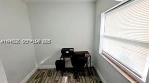 A small room features a desk with a printer, a black chair, and a window — 88 NE 68th Ter # 88, Miami FL 33138, MIAMI, FL