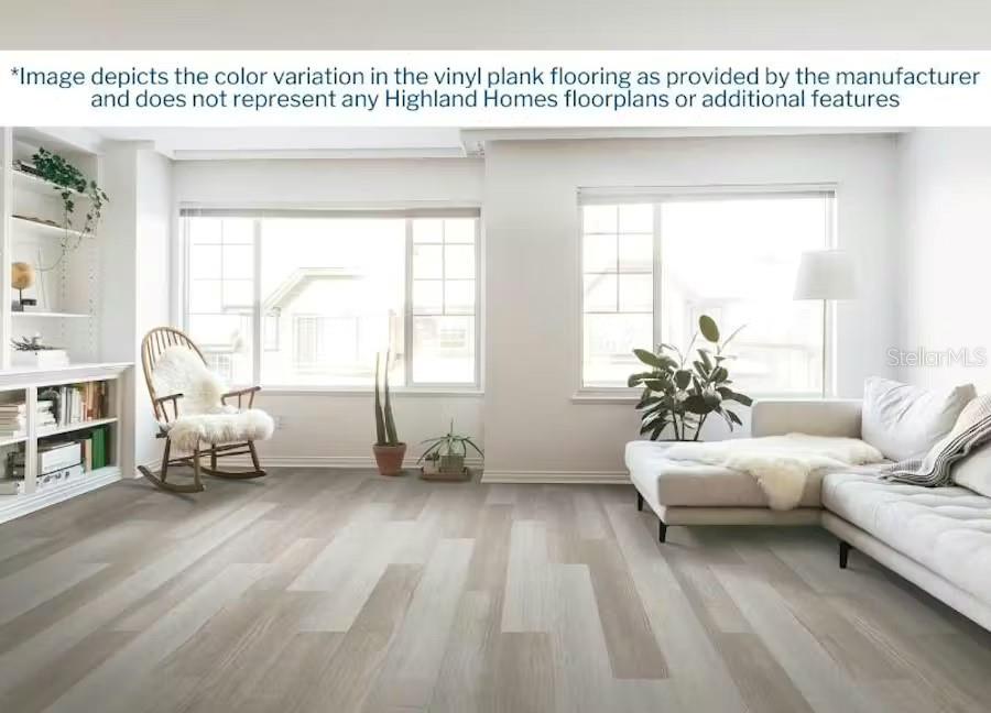 This digital rendering shows a bright living room with light wood-look vinyl plank flooring — 6769 FLAGSTONE AVENUE E, LAKELAND, FL