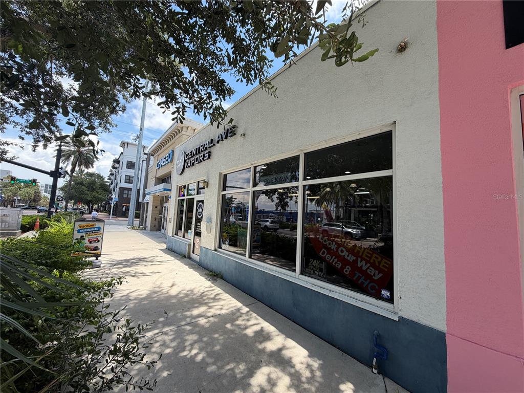 The exterior of a retail storefront features large windows and signage for a vape shop — 1610 CENTRAL AVENUE, ST PETERSBURG, FL