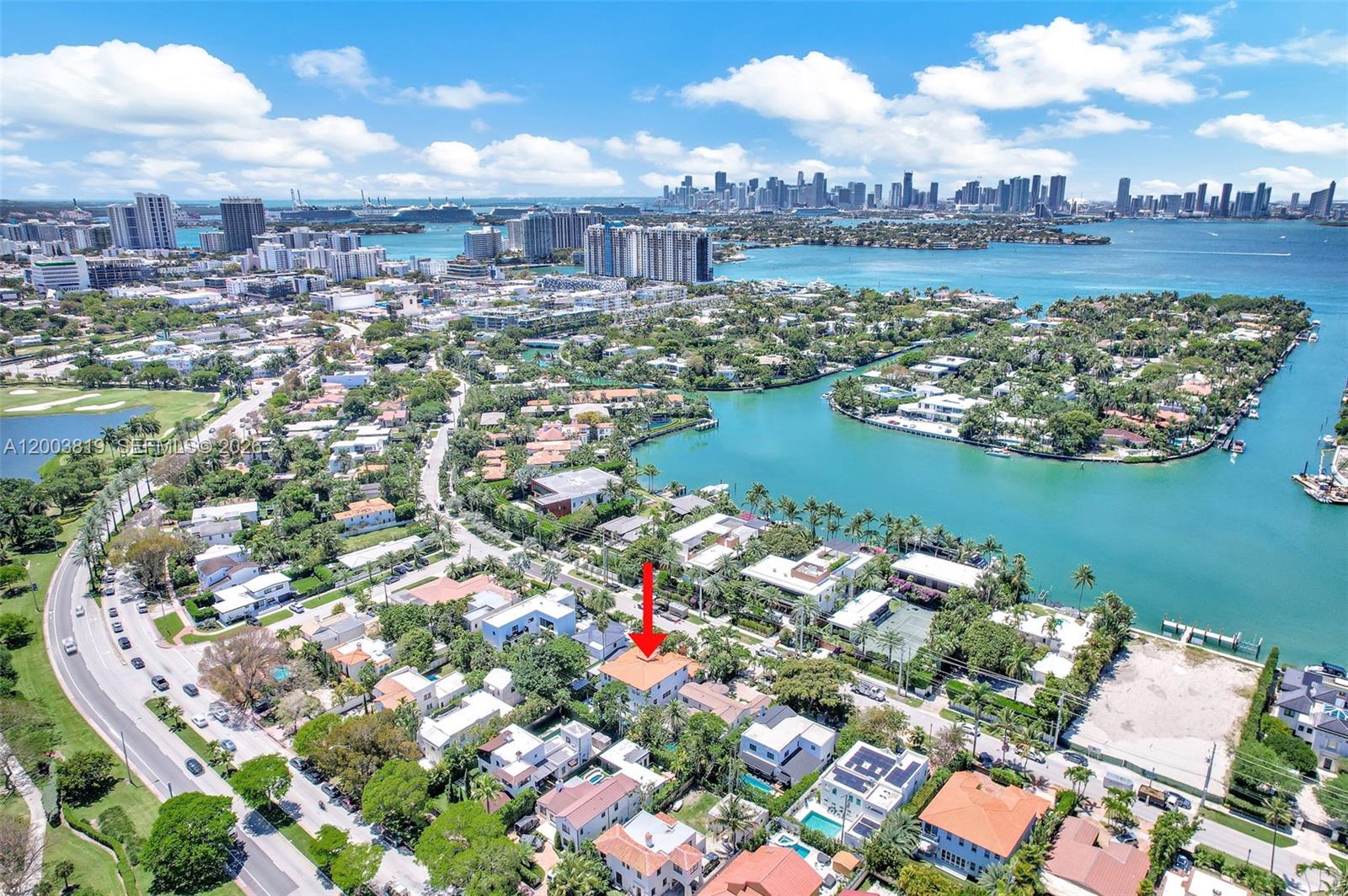 An aerial view shows a residential neighborhood with a red arrow pointing to a house — 2143 N Bay Rd, Miami Beach FL 33140, MIAMI BEACH, FL