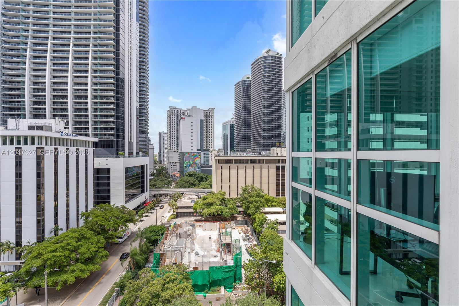 An elevated view shows a city street, construction site, and surrounding high-rise buildings — 951 Brickell Ave # 1011, Miami FL 33131, MIAMI, FL