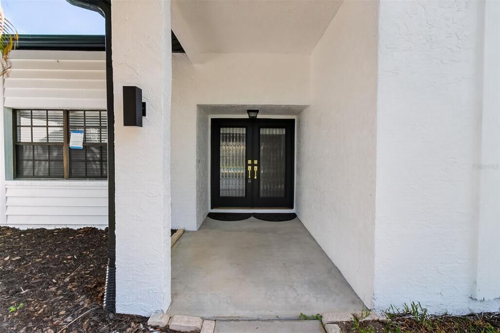 This is a floor plan of a single-story house featuring a large screened patio — 2135 VANCE AVENUE, PALM HARBOR, FL