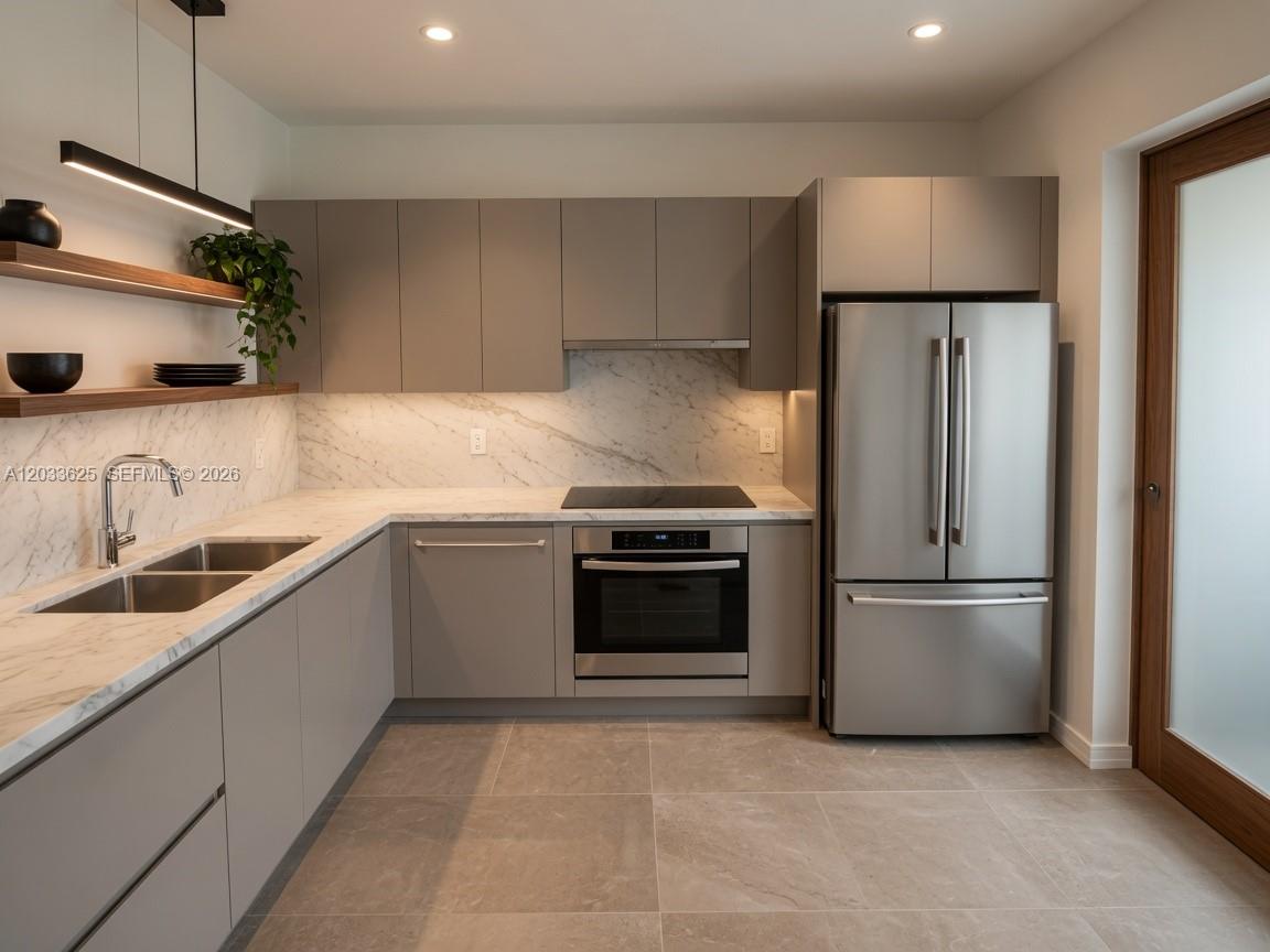 A modern kitchen features gray flat-panel cabinets, stainless steel appliances, and white marble countertops — 13120 SW 64th Ter # 1504, Miami FL 33183, MIAMI, FL