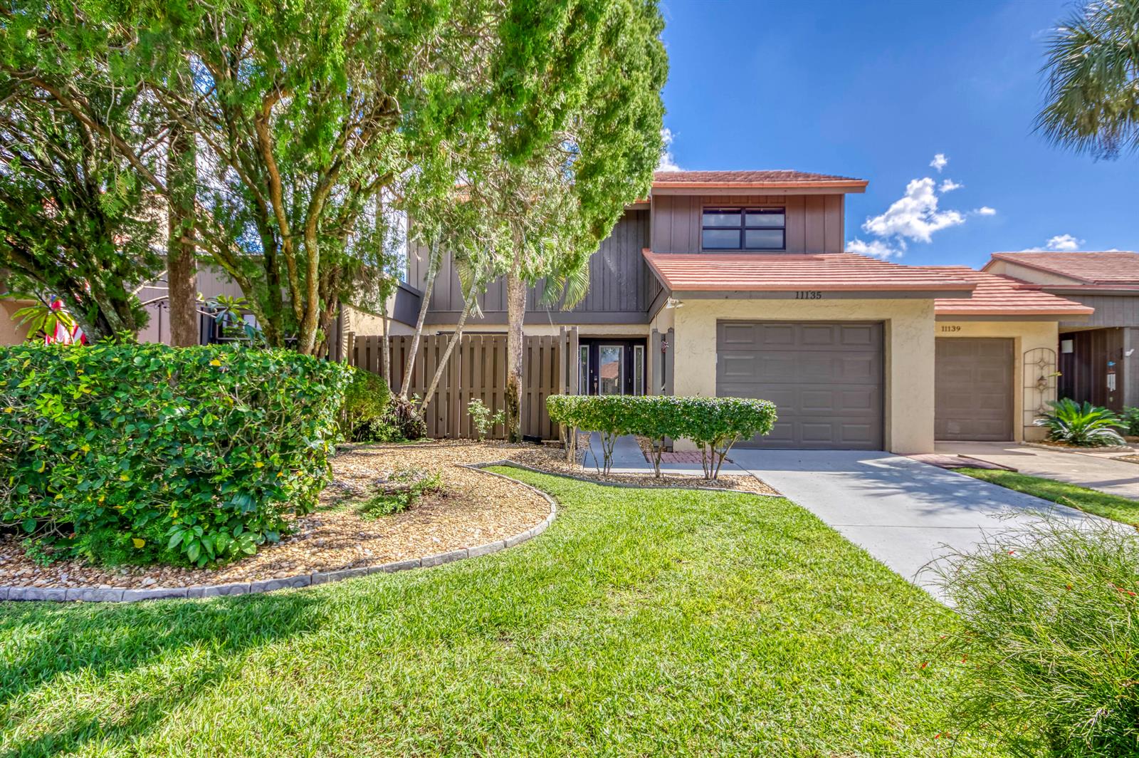 A two-story house with a brown garage, tile roof, and a landscaped front yard — 11135 Oakdale Road, Boynton Beach FL 33437, BOYNTON BEACH, FL