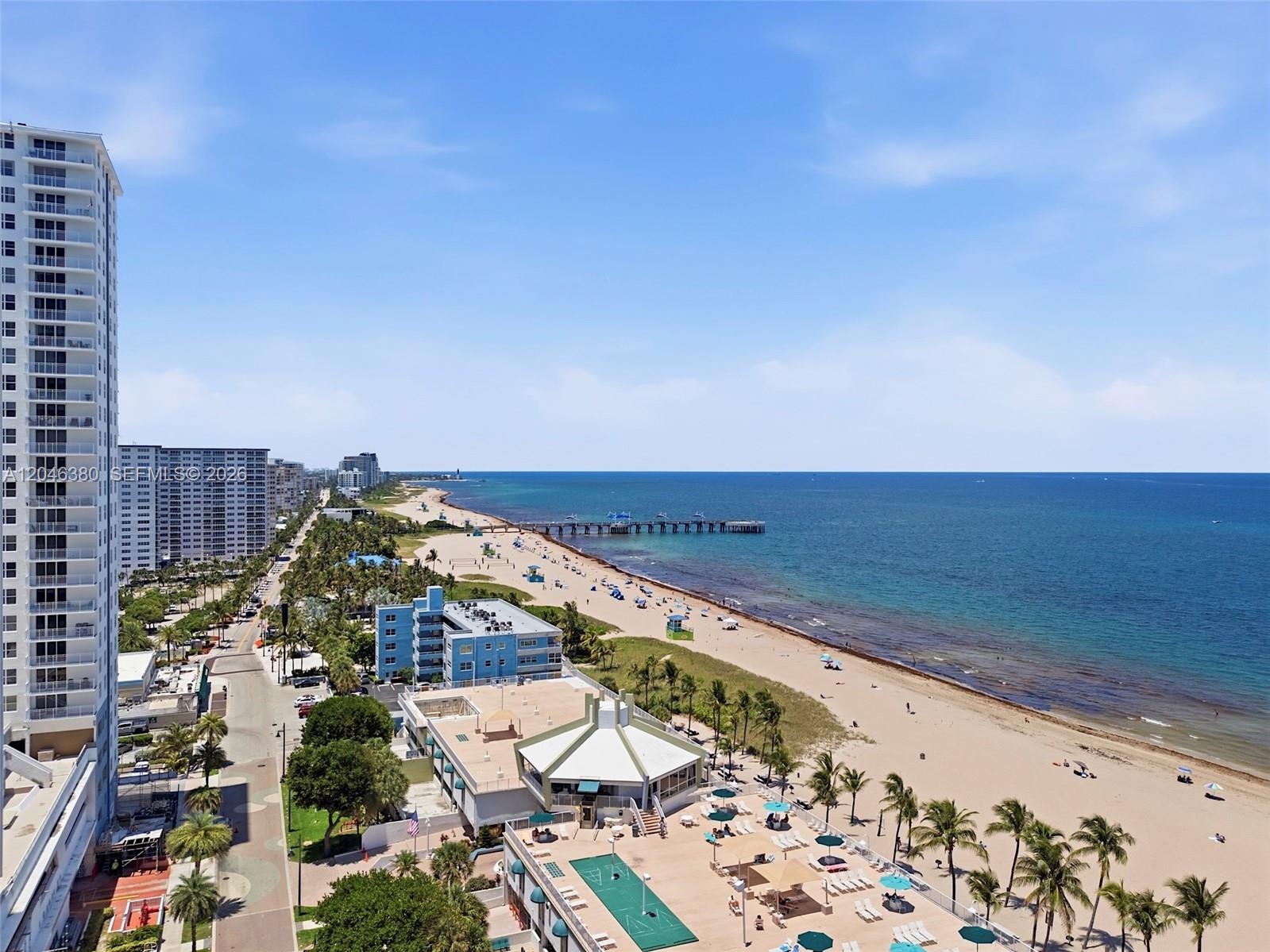 An aerial view shows a beach, a pier, and high-rise buildings along the coast — 111 N BRINY AVE, Pompano Beach FL 33062, POMPANO BEACH, FL
